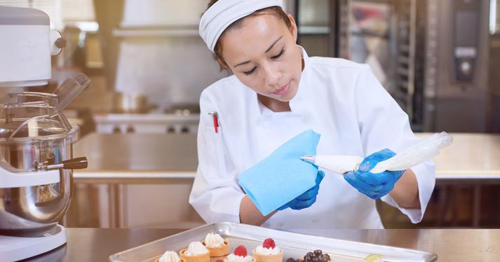 Female chef making pastries